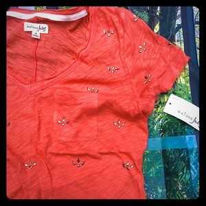 Small T-shirt with metallic bead accents.